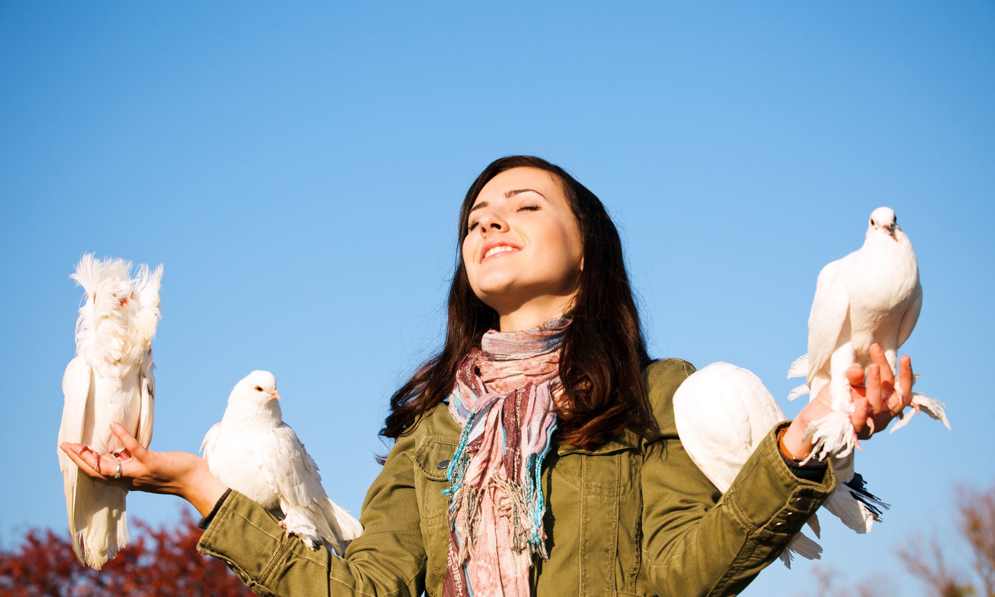 white doves on woman's arms