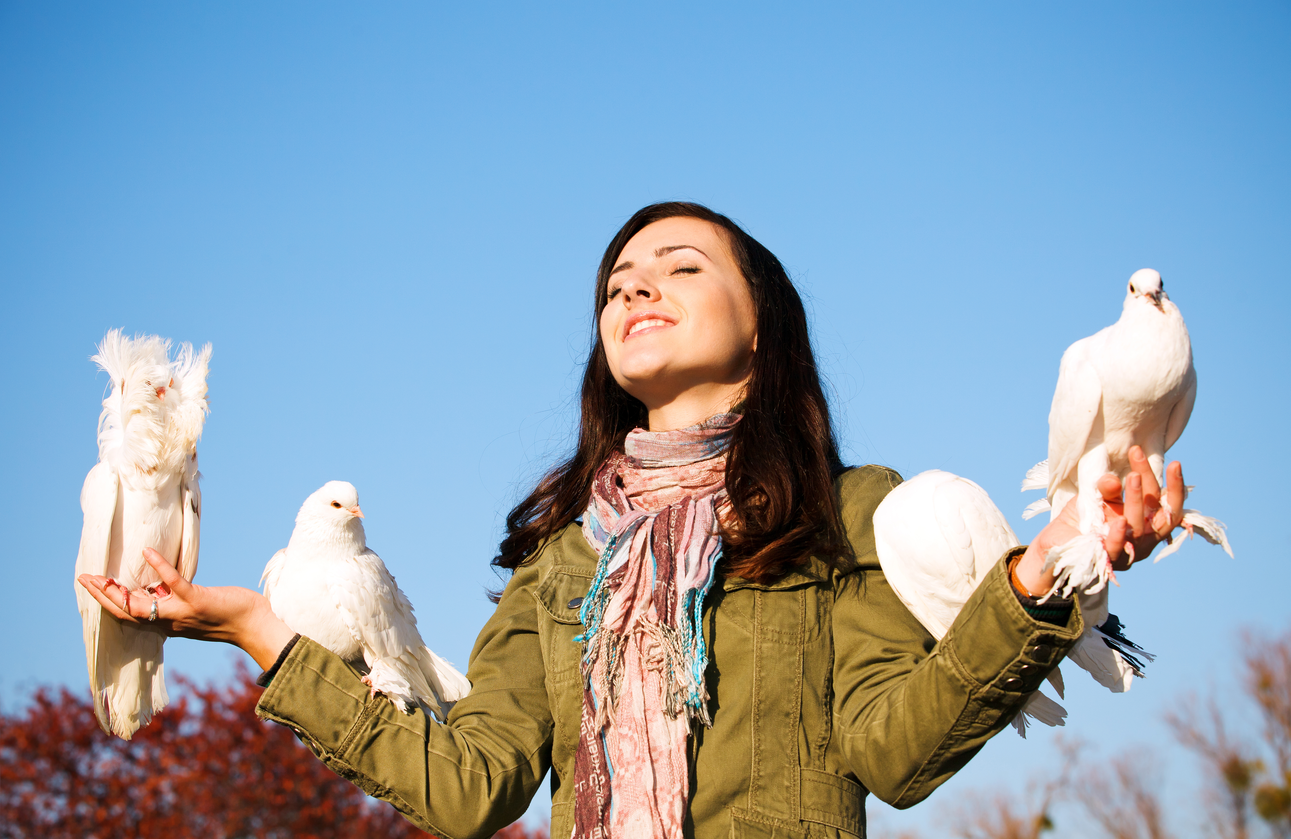 Woman with white doves